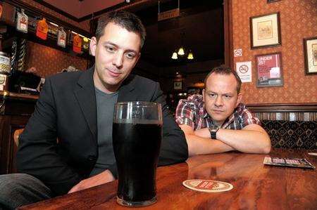 Owner Steven Haynes, left, and events manager Mark Leith keep an eye on a pint at the table and the spot where the latest incident happened