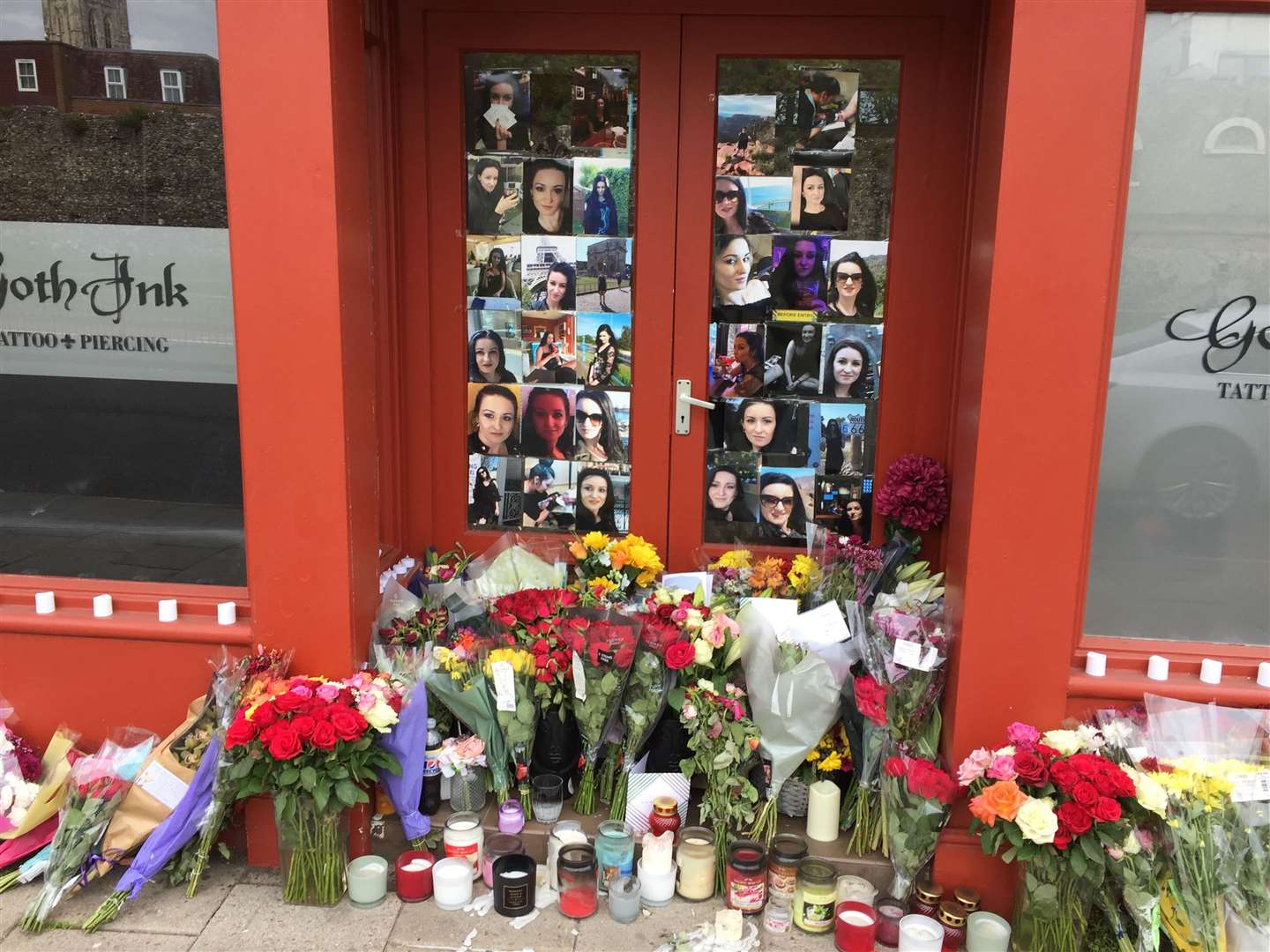 Tributes to Ramona Stoia, 35, outside the GothInk tattoo parlour in Canterbury