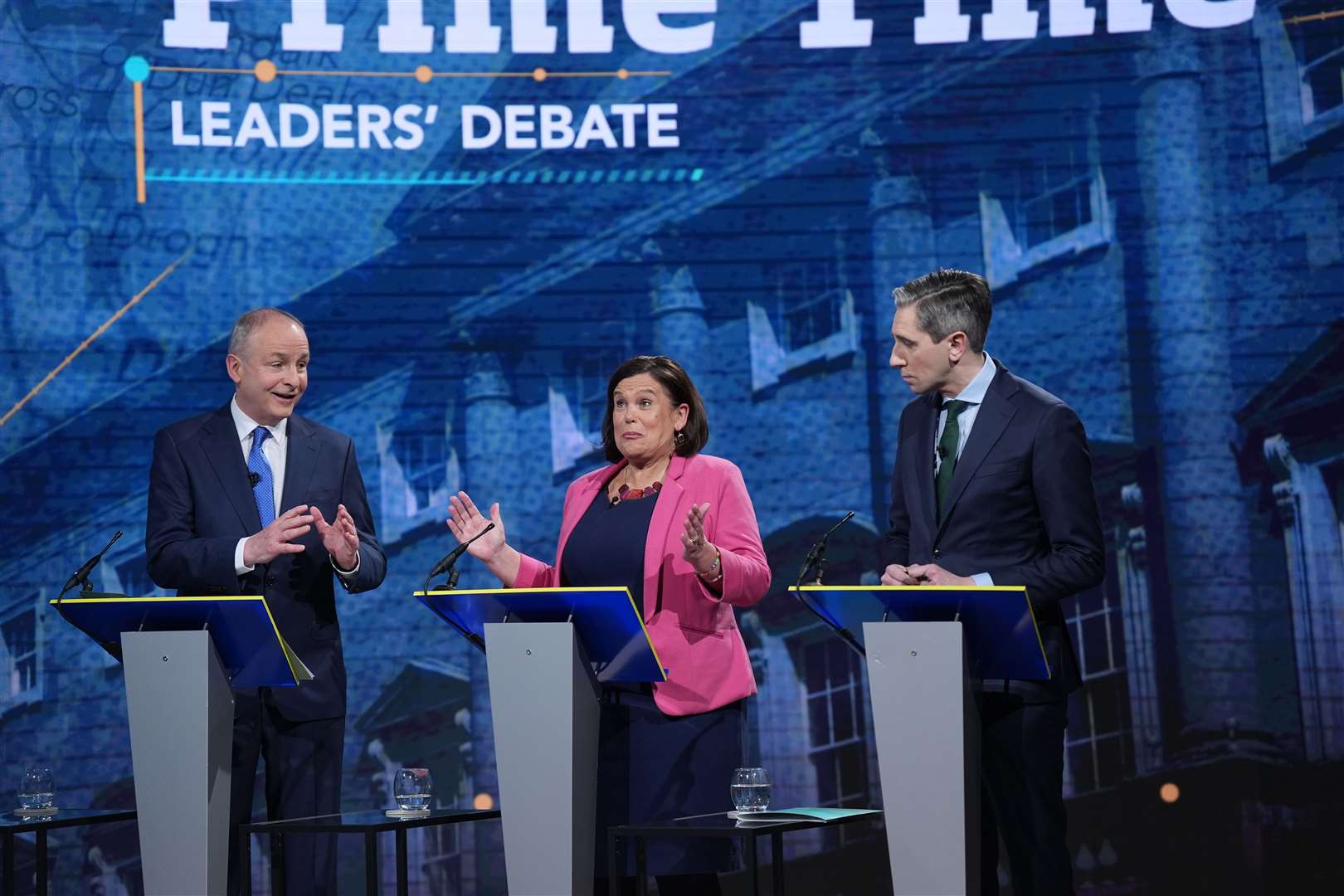 Mr Martin, Ms McDonald and Mr Harris (left to right) during the final leaders’ debate (Niall Carson/PA)