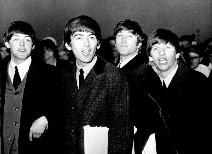 The Beatles at London Airport as they return home from their visit to America (PA)