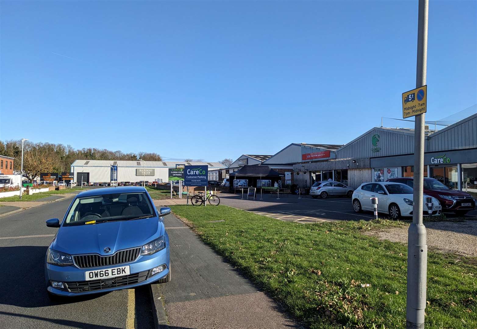 Andy's car parked next to a sign stating heavy goods vehicles could not park on the road