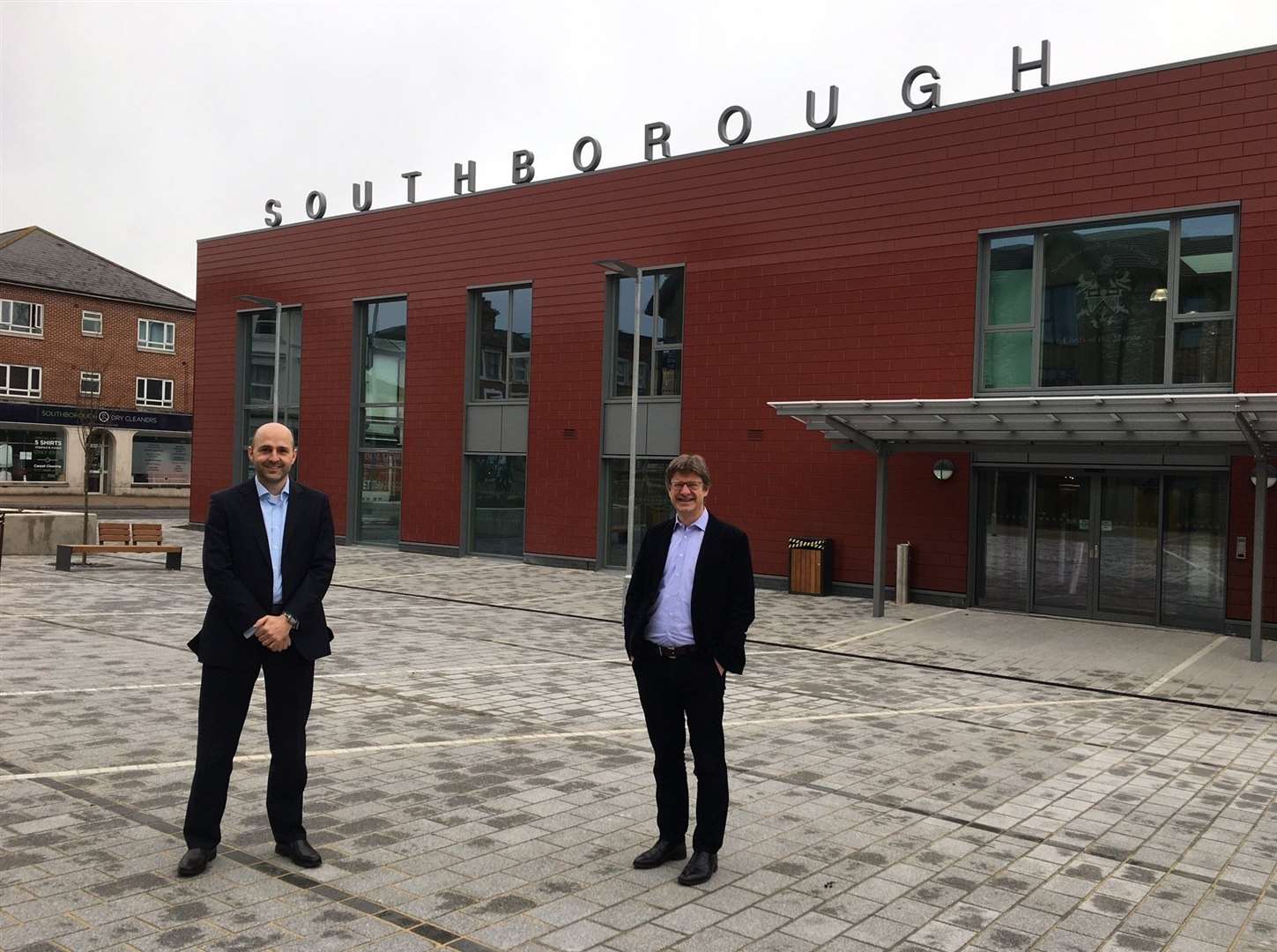 Project manager Jonathan White, left, with MP Greg Clark outside the new civic centre in Southborough