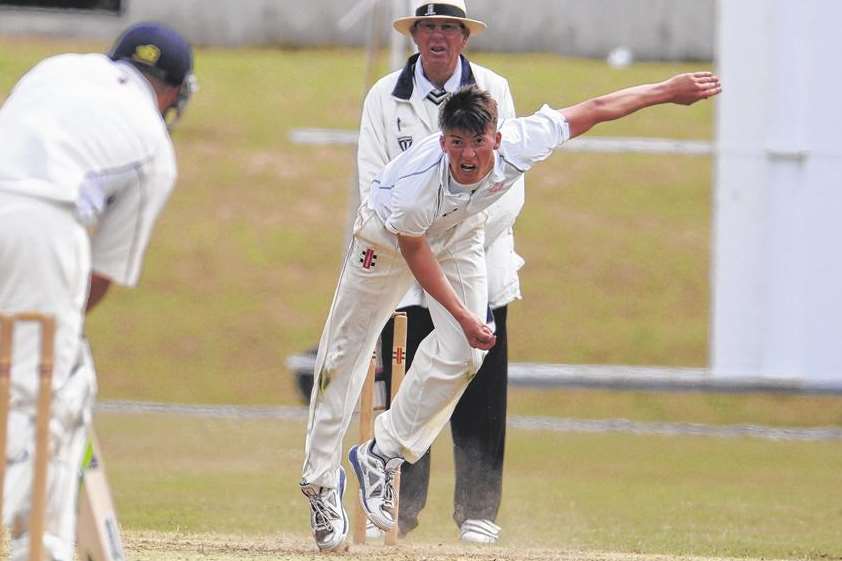 Hugh Bernard bowling for Folkestone against local rivals Sibton Park Picture: Gary Browne