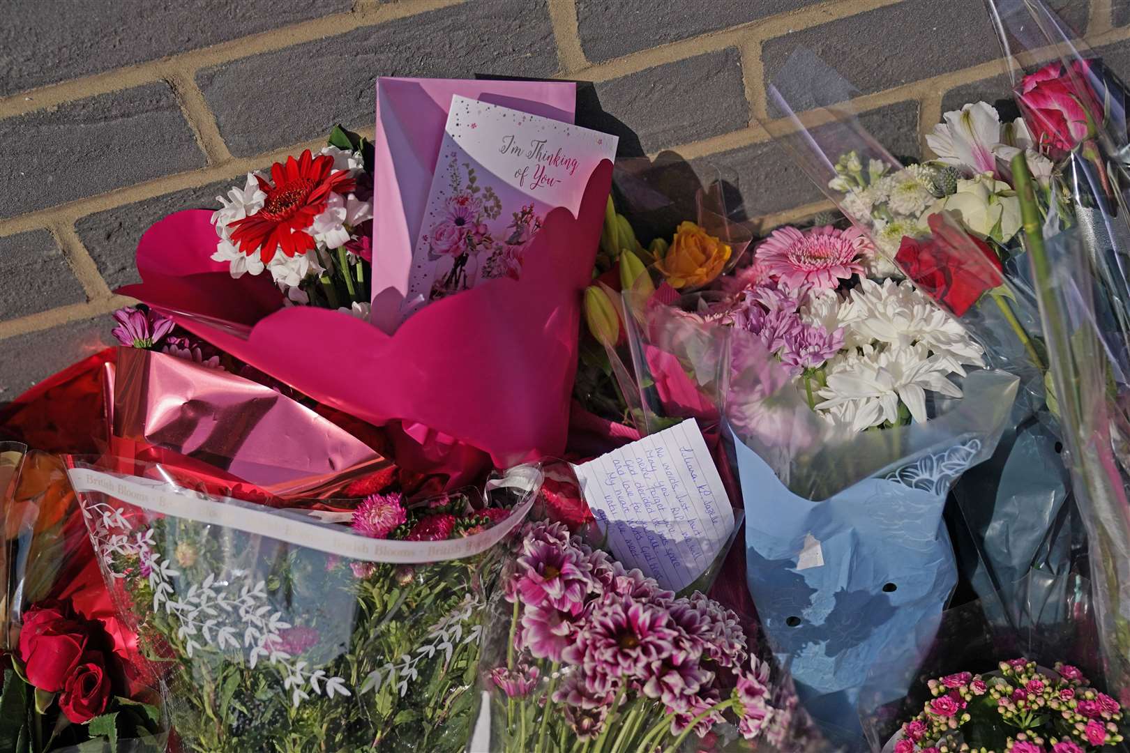 Floral tributes were left outside Leabank flats (Jacob King/PA)