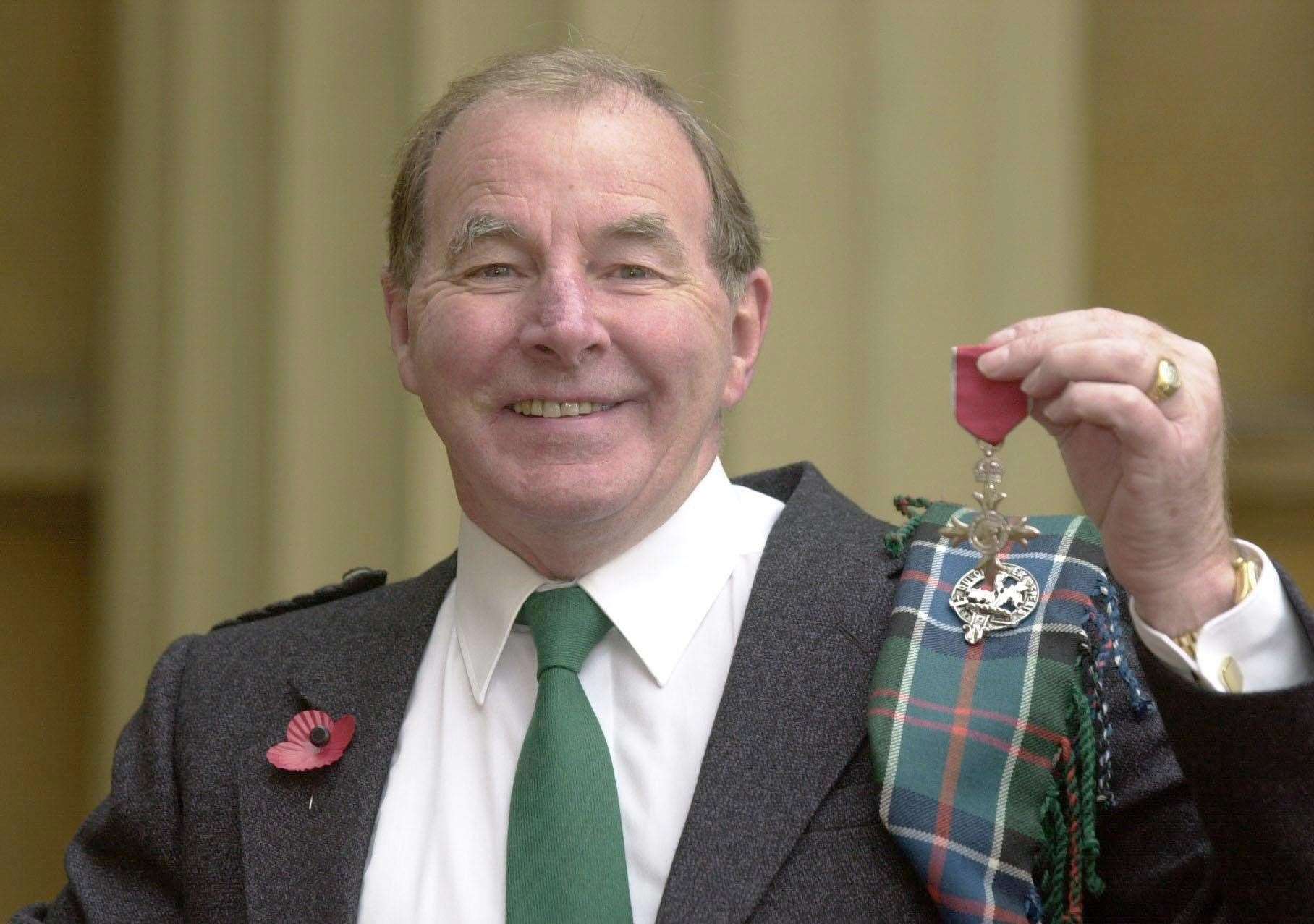 Sydney Devine after receiving his MBE in 2003 (Matthew Fearn/PA)