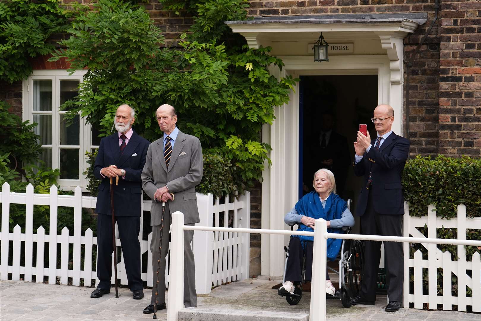 Prince Michael of Kent, the Duke of Kent, the Duchess of Kent and Lord Nicholas Windsor watch the three pipers outside Wren House (Jordan Pettitt/PA)