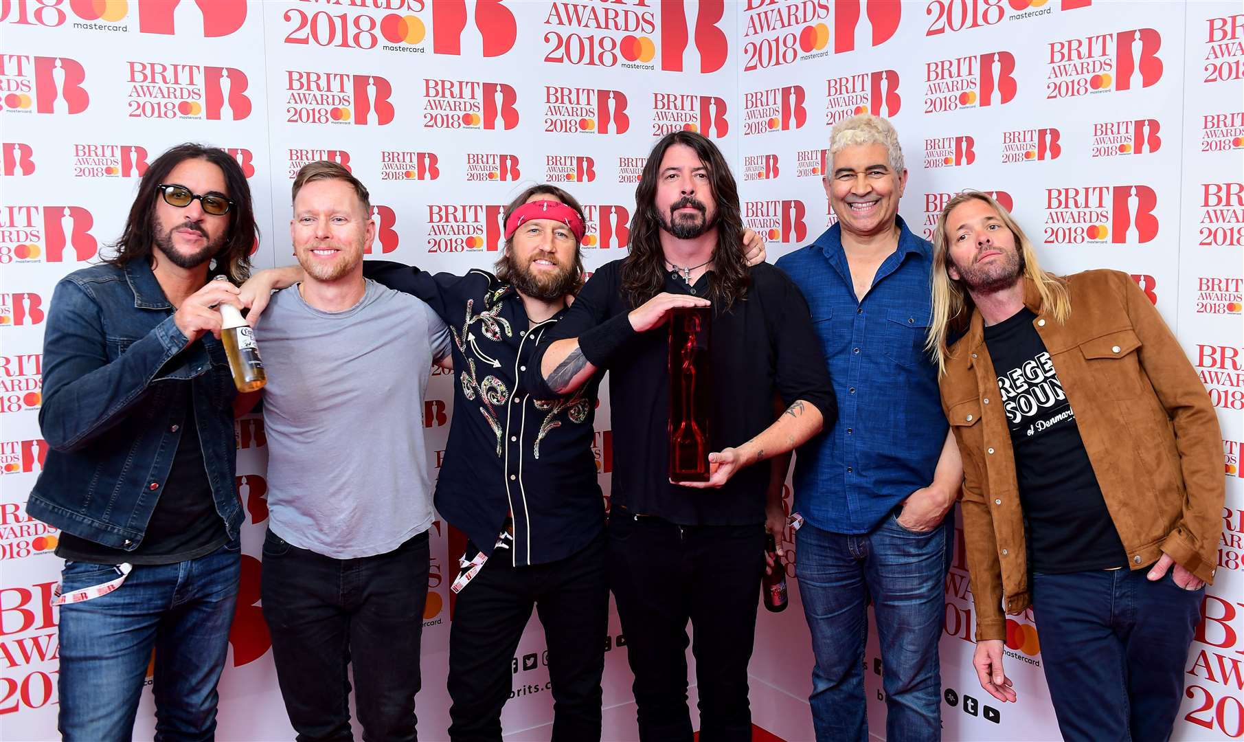 Foo Fighters with their award for Best International Group during the 2018 Brit Awards (PA)