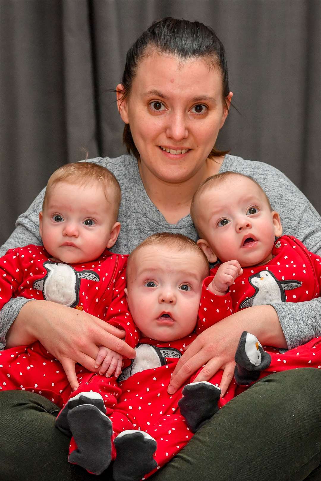 Six-month-old triplets (left to right) Emmeline, Rafferty and Willoughby, with mother Shelley Davis (Ben Birchall/PA)