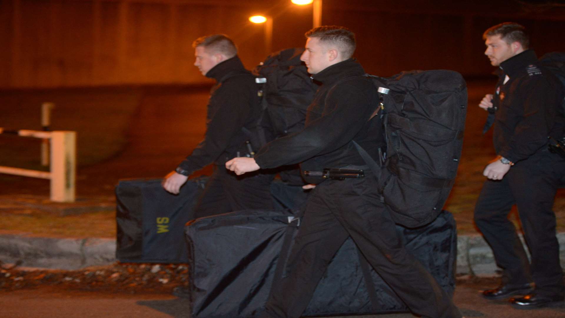 Tornado Squad members move in. Picture: SWNS