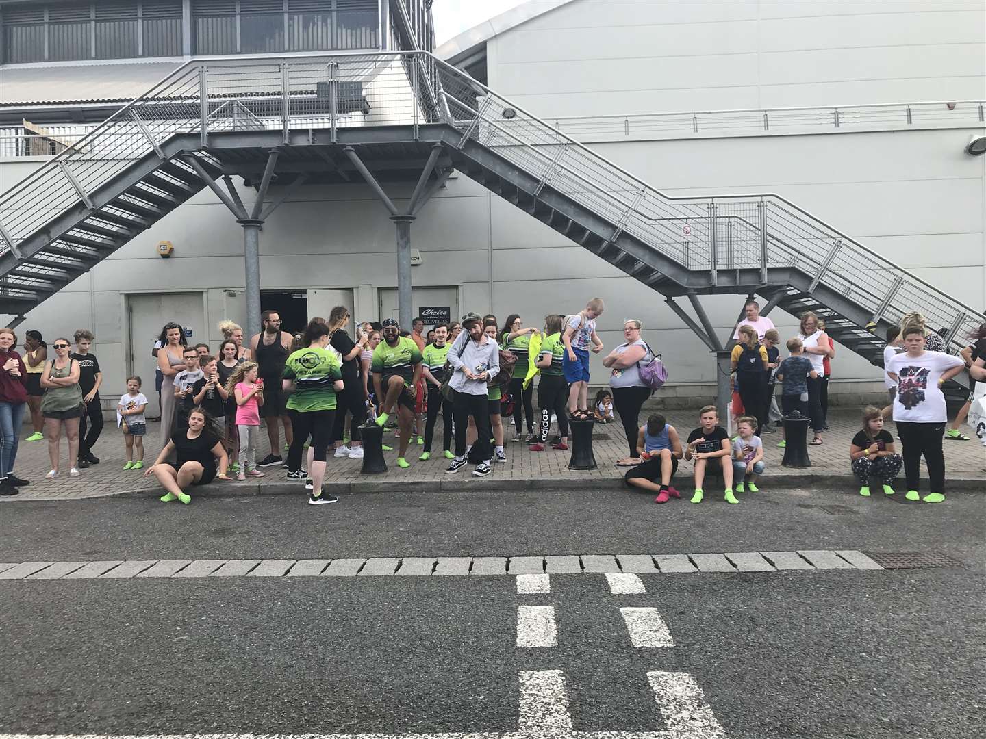 Shoppers and gym goers stand outside the Dockside Outlet in Chatham after the power cut