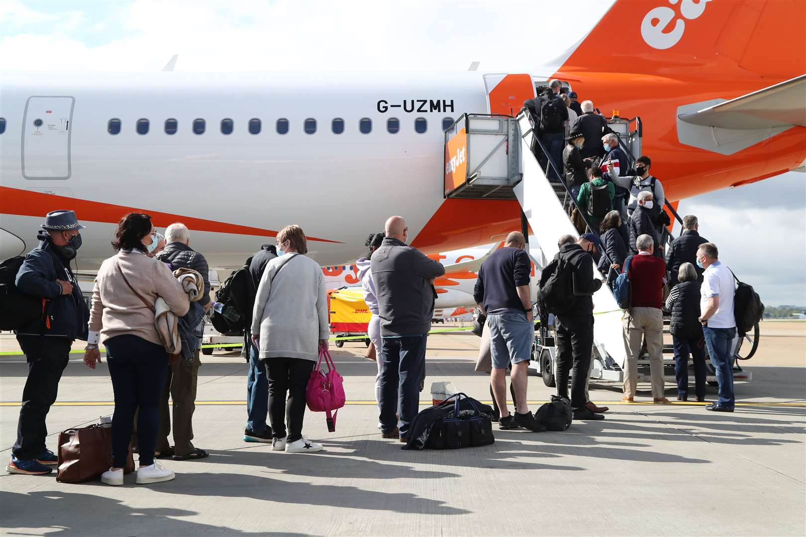 Passengers prepare to board an easyJet flight to Faro, Portugal, at Gatwick Airport (Gareth Fuller/PA) 