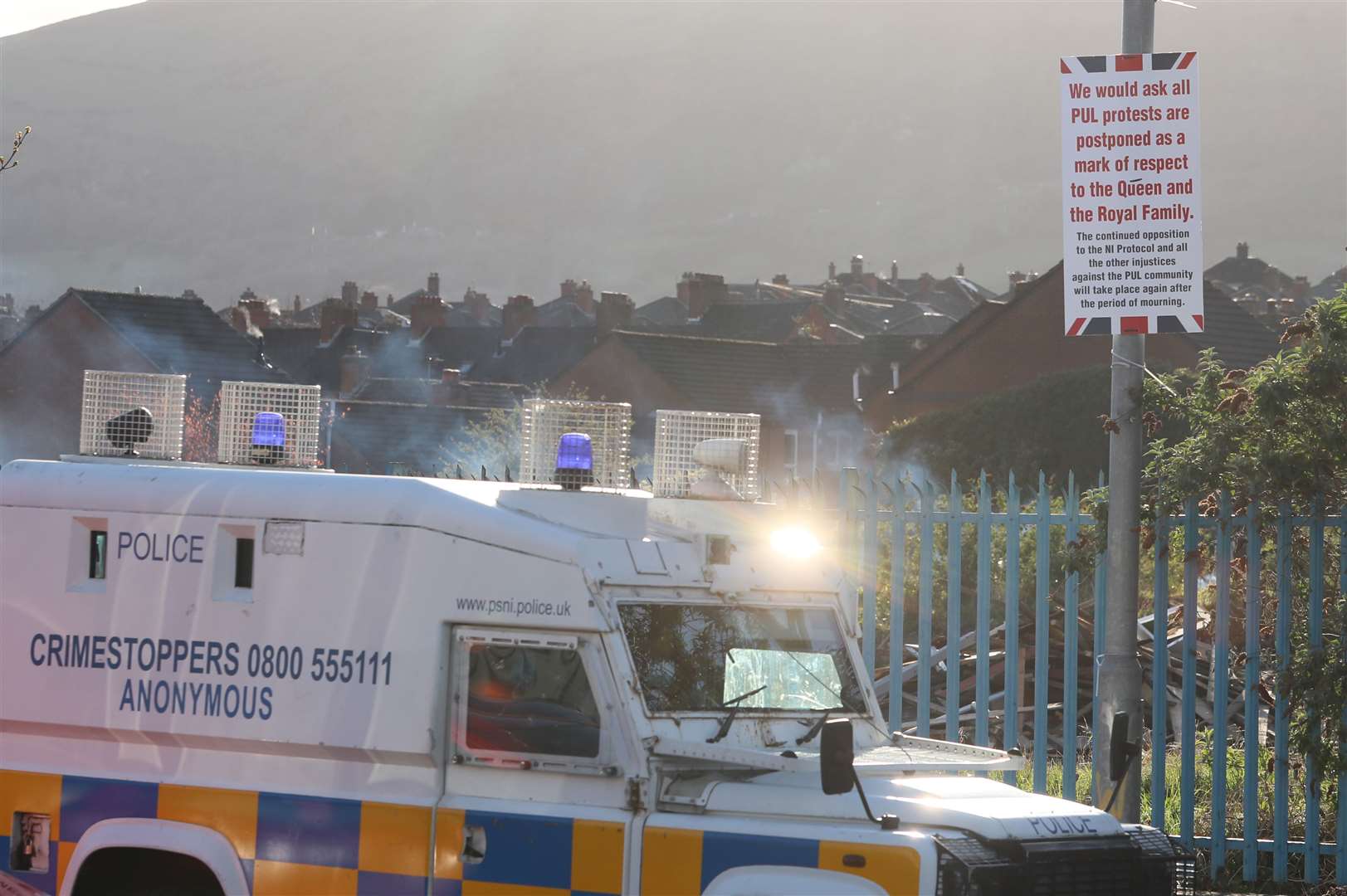 A sign in Belfast calling for the postponement of ongoing protest as a mark of respect (Brian Lawless/PA)