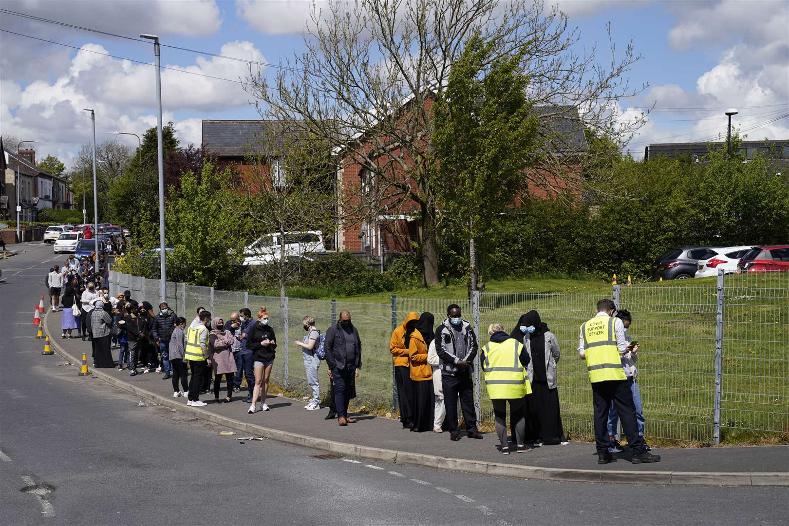 People queuing for Covid vaccinations in Bolton (Danny Lawson/PA)