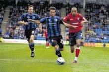 Gillingham's Jack Payne is chased down by Shrewsbury's Mark Wright