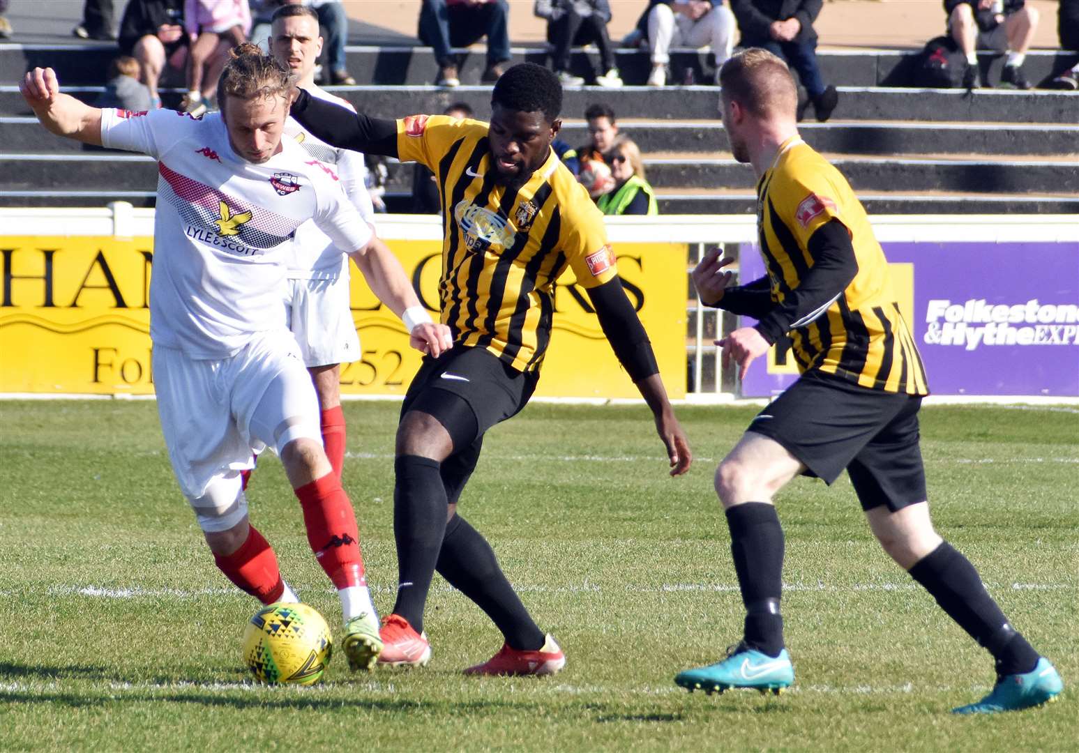 Folkestone striker Dave Smith gets stuck in during their weekend defeat to Lewes. Picture: Randolph File