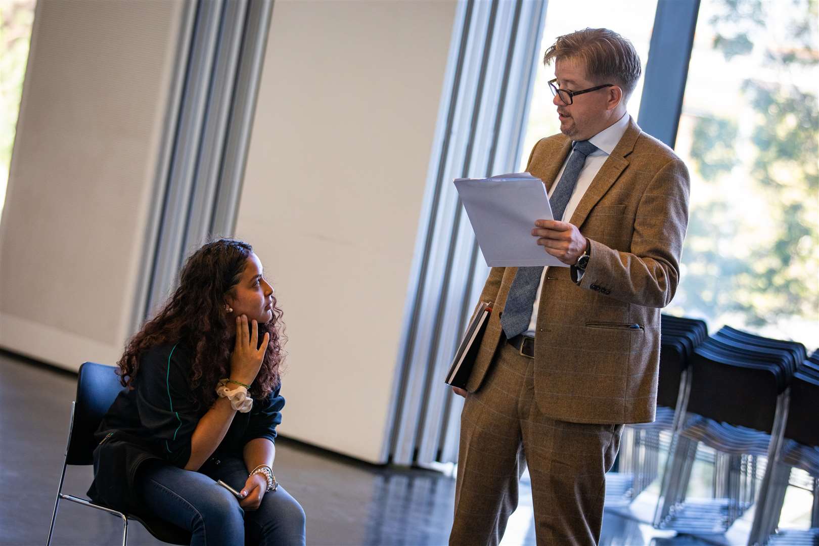 Principal Tim Dainty looks at the GCSE results of Brenda Cinotti at Ark Evelyn Grace Academ (Aaron Chown/PA)