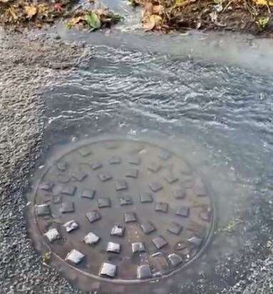 Sewage coming out of a manhole cover in Frognal Lane in October. Picture: Wayne Kennett