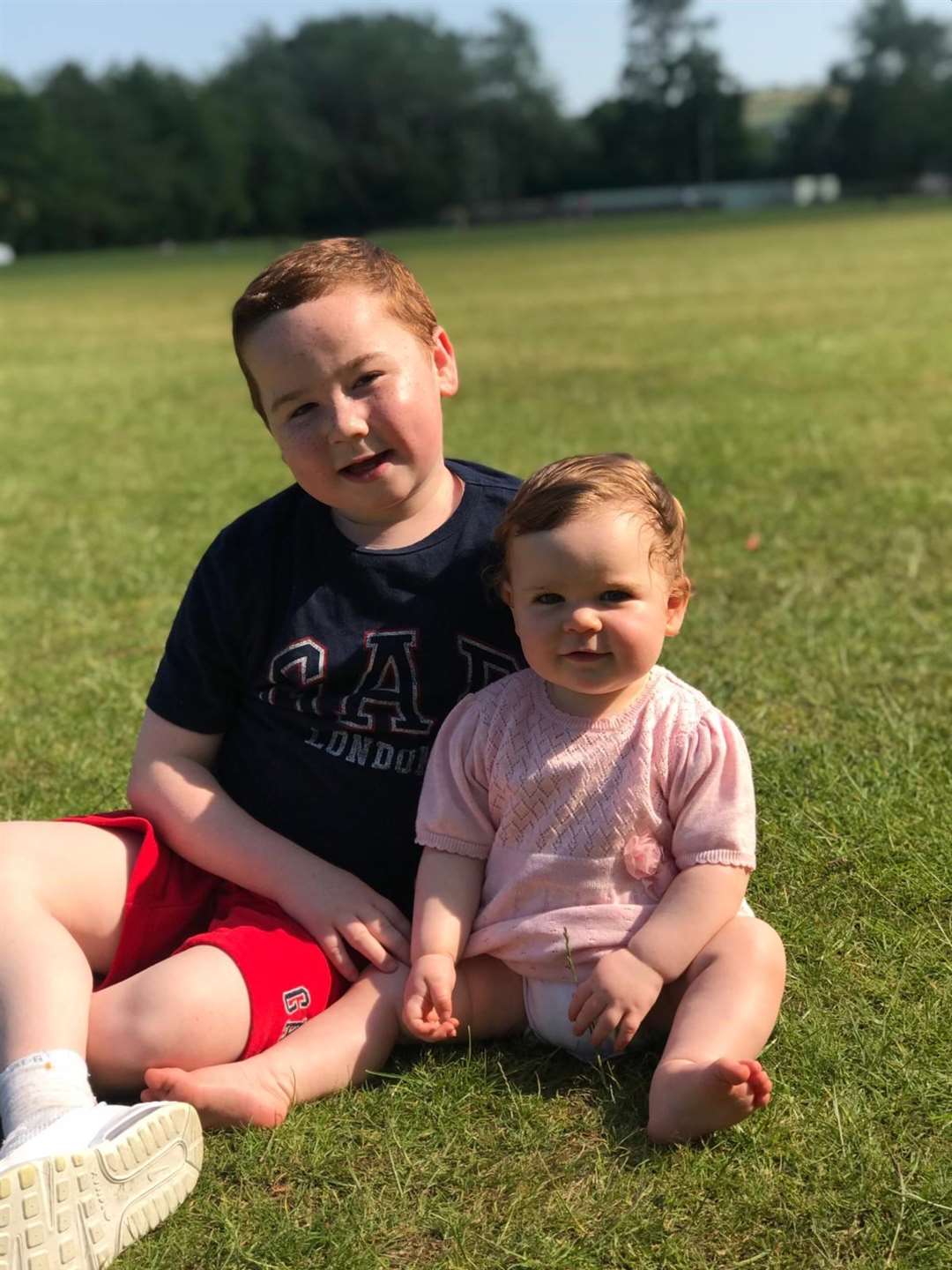 David and sister Eimear in the grounds of the Stormont estate this week. The family have been able to take one outside trip a day for exercise since restrictions on those shielding eased (McKenna family/PA)