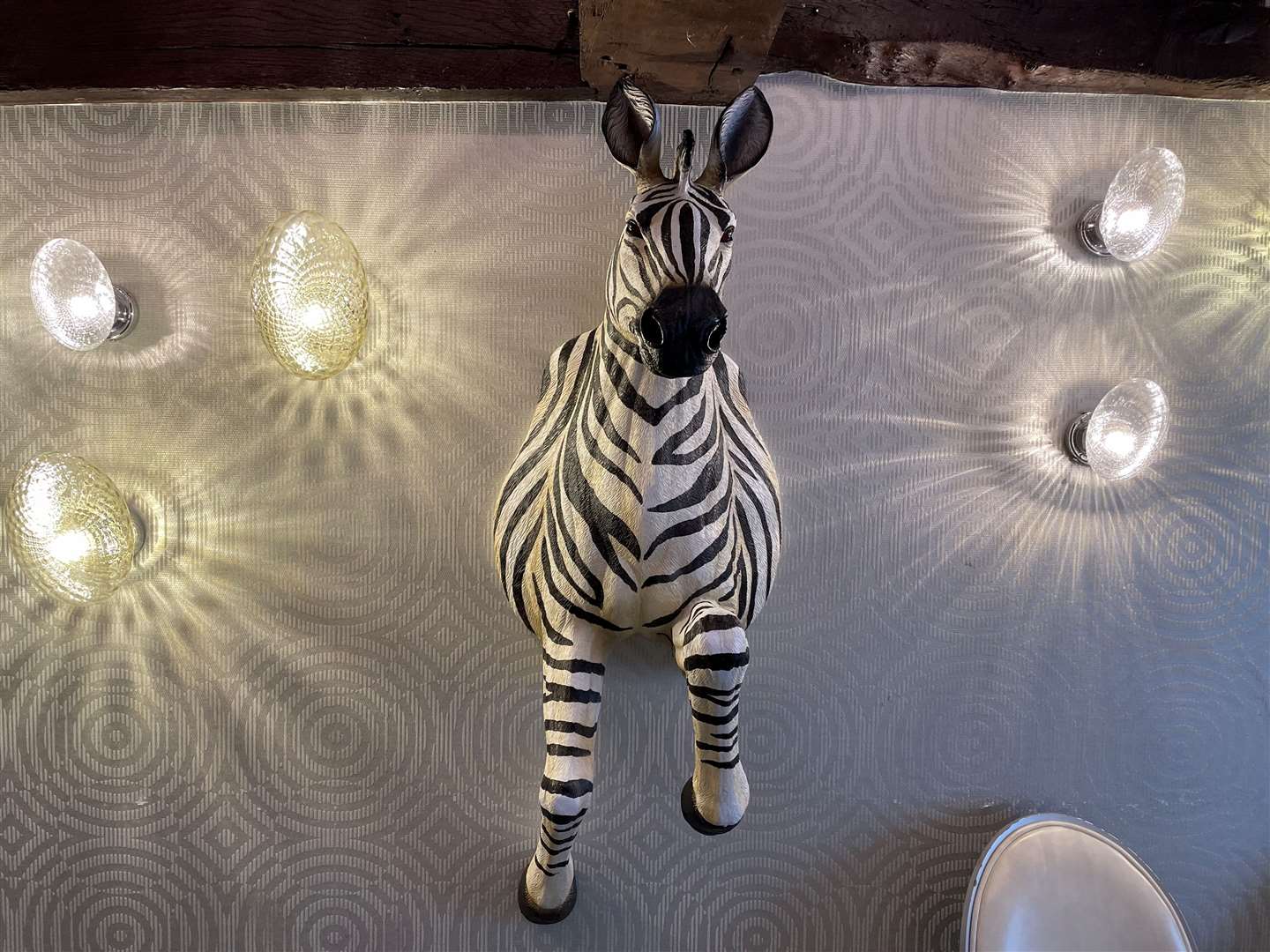 Upstairs has been renamed the “zebra room” due to its feature wall