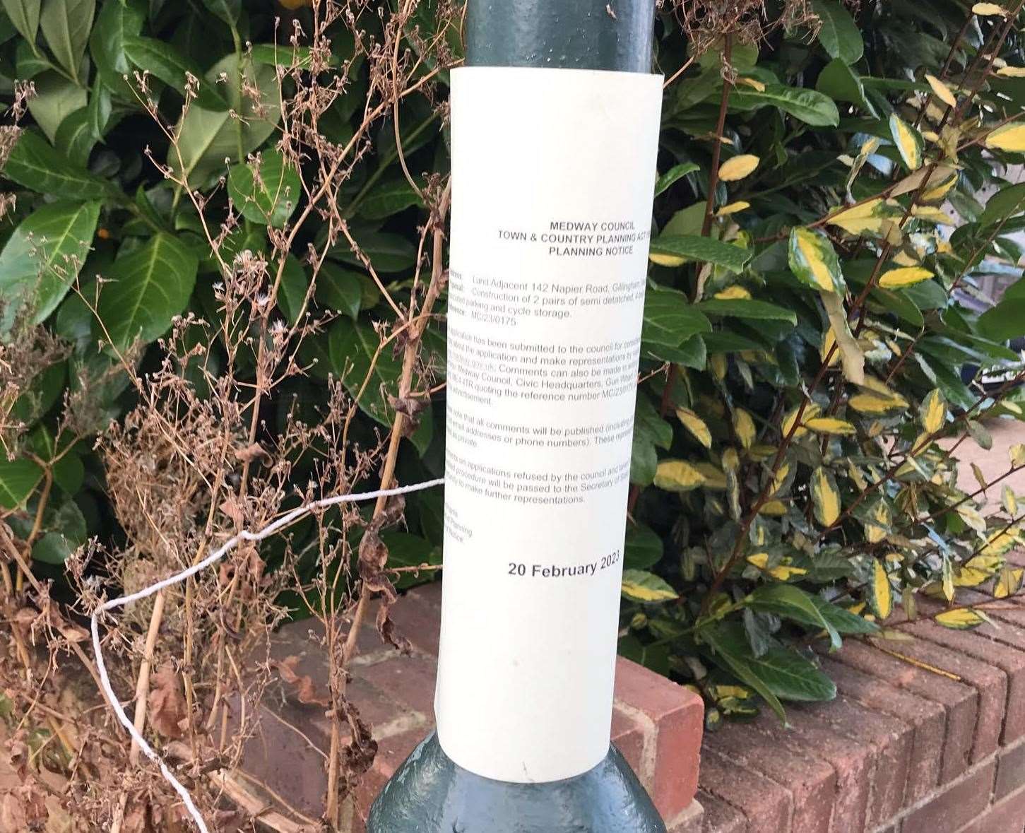 A Medway Council planning notice placed on nearby lamppost for the homes in Napier Road, Gillingham