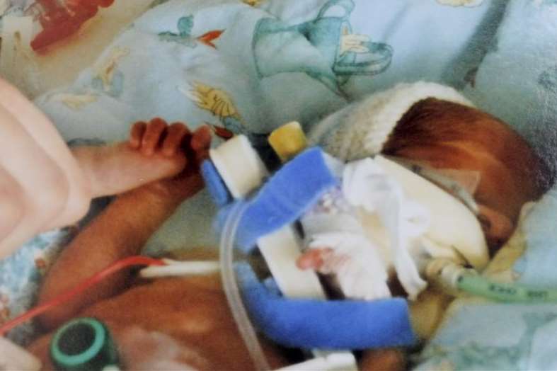 At just one day old, Owen Piper holds onto his dad’s little finger