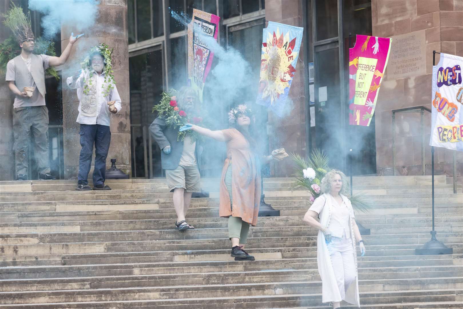 Performers entertain the crowd before modern day Godivas selected by public nomination ride on horseback accompanied by women bearing banners and flags during Coventry UK City of Culture’s signature event (Fabio De Paola/PA)