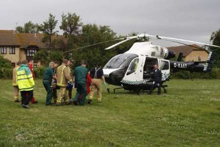 Woman being carried to air ambulance