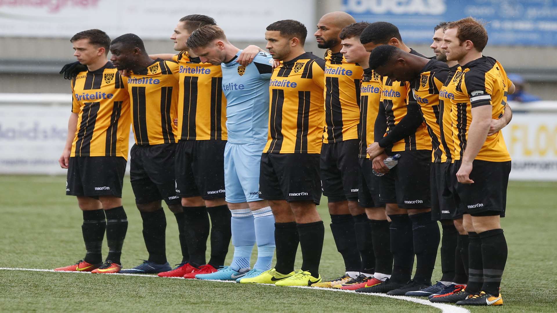 Maidstone's players pay their respects to former England and West Brom striker Cyrille Regis, who died last week Picture: Andy Jones