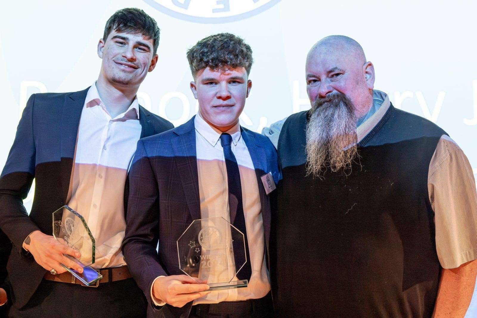 Owen Edwards and Harry James, who were the overall winners along with friend Nathan Pennock, pictured with Russell Kimble, son of Richard Kimble. Picture: Pillory Barn