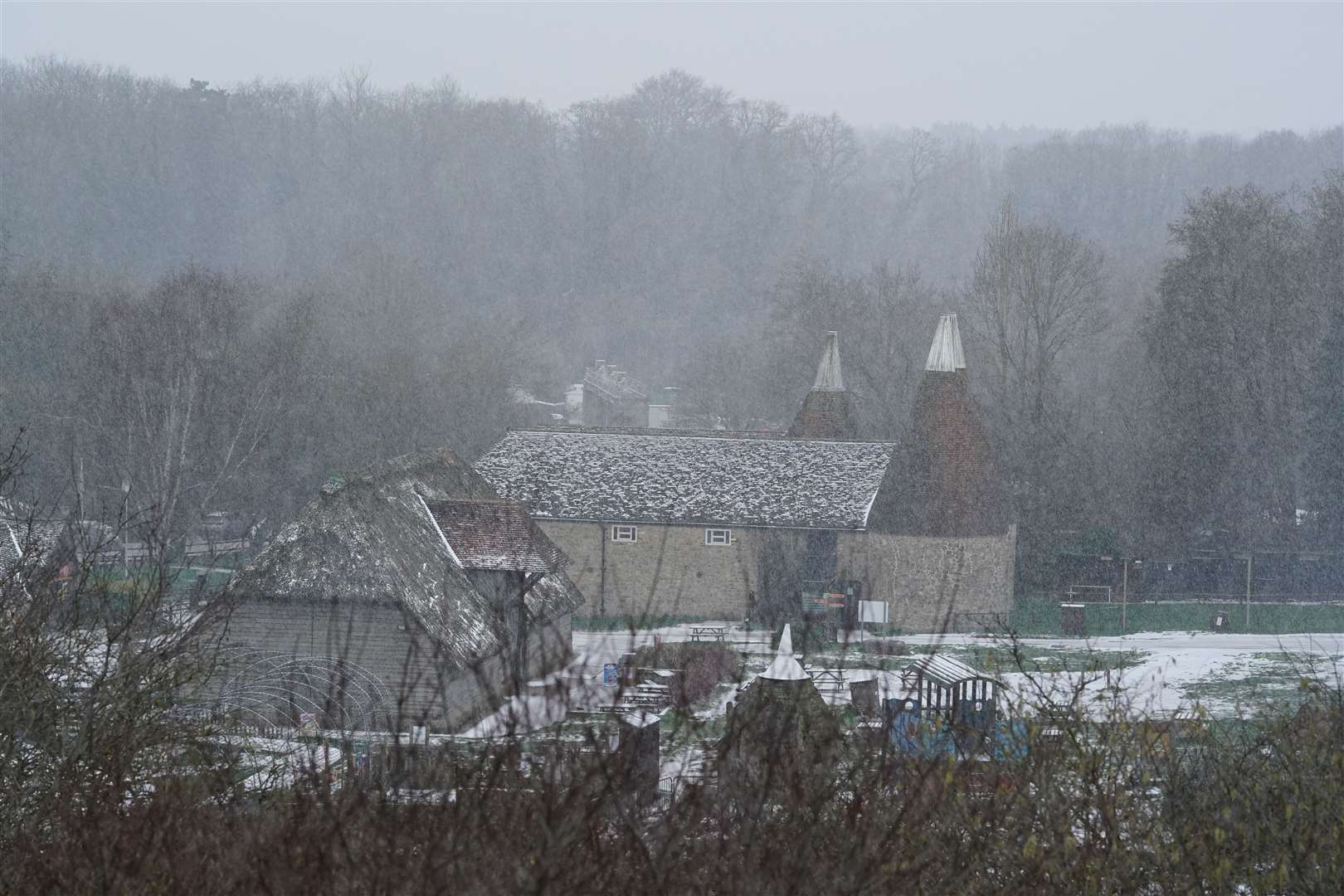 Snow falls on buidlings near Maidstone in Kent (Gareth Fuller/PA)