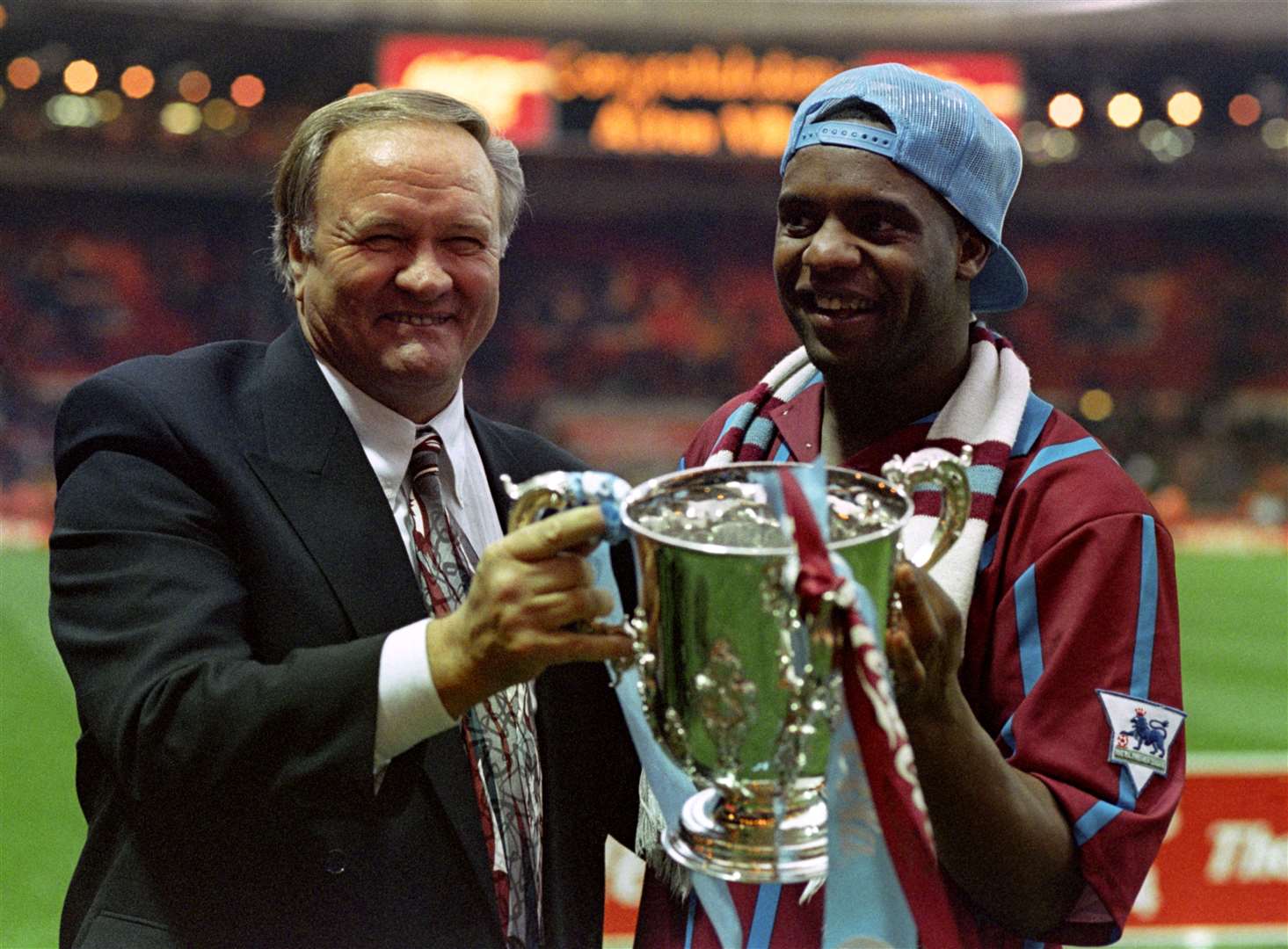 Former Aston Villa manager Ron Atkinson holds the League Cup with Dalian Atkinson (Tony Harris/PA)