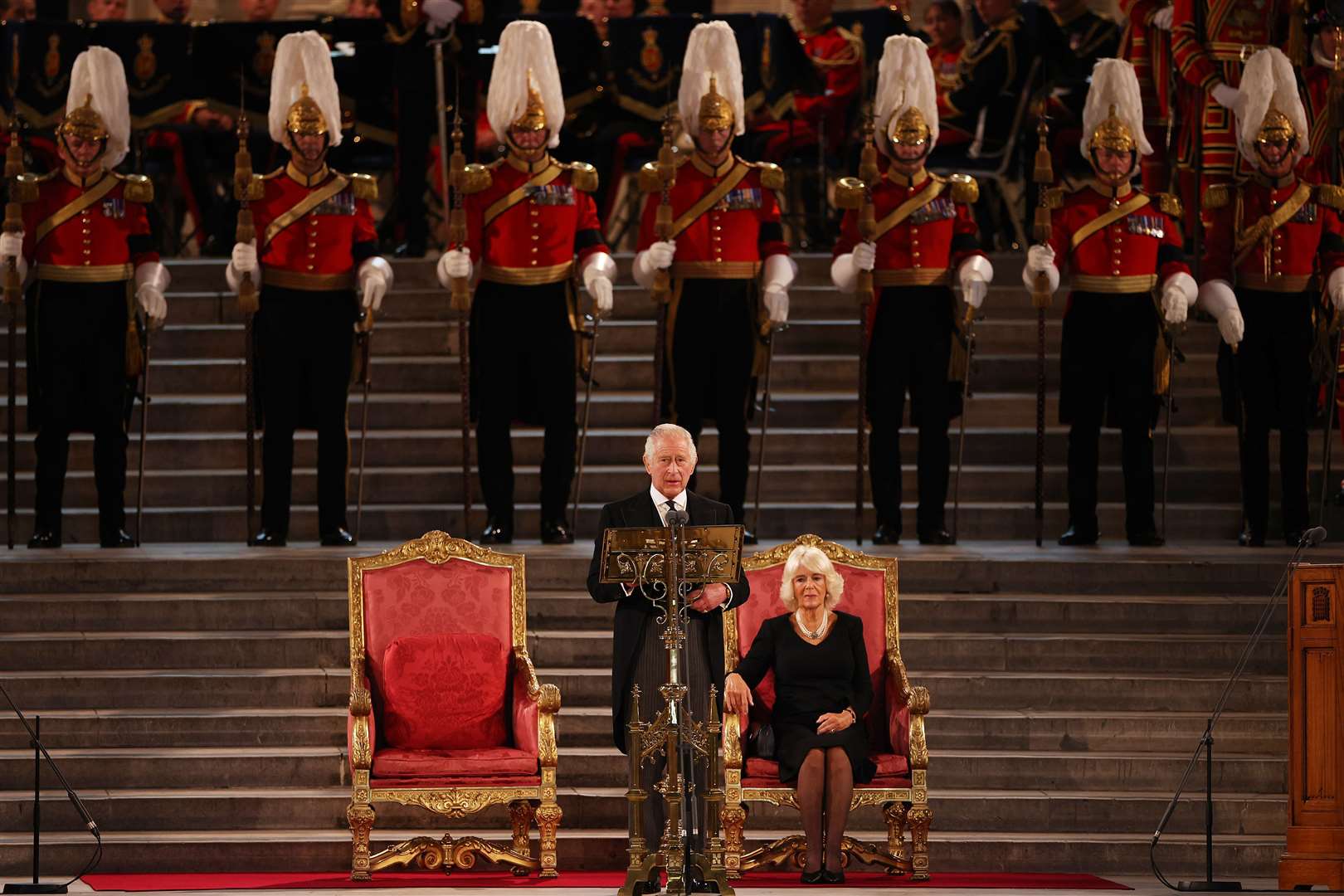 Charles gives his address thanking the members of the House of Lords and the House of Commons for their condolences, at Westminster Hall, London, as the Queen Consort looks on (Dan Kitwood/PA)