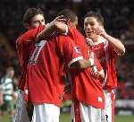 WE'RE THROUGH: Bryan Hughes and Matt Holland celebrate Shaun Bartlett's goal. Picture: MATT WALKER