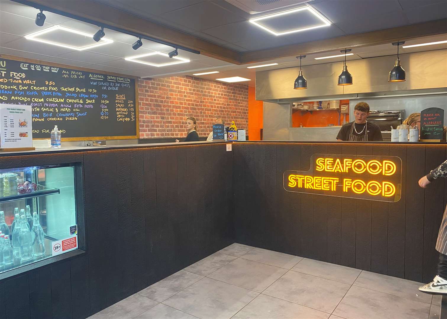 The ordering counter and kitchen in the new venue which opened in June