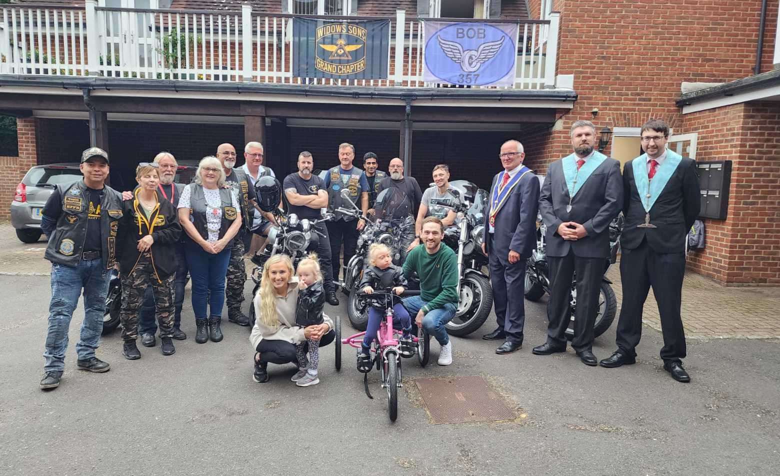 April Ells was presented with a pink bike to help her movement. Picture: Chris Ells