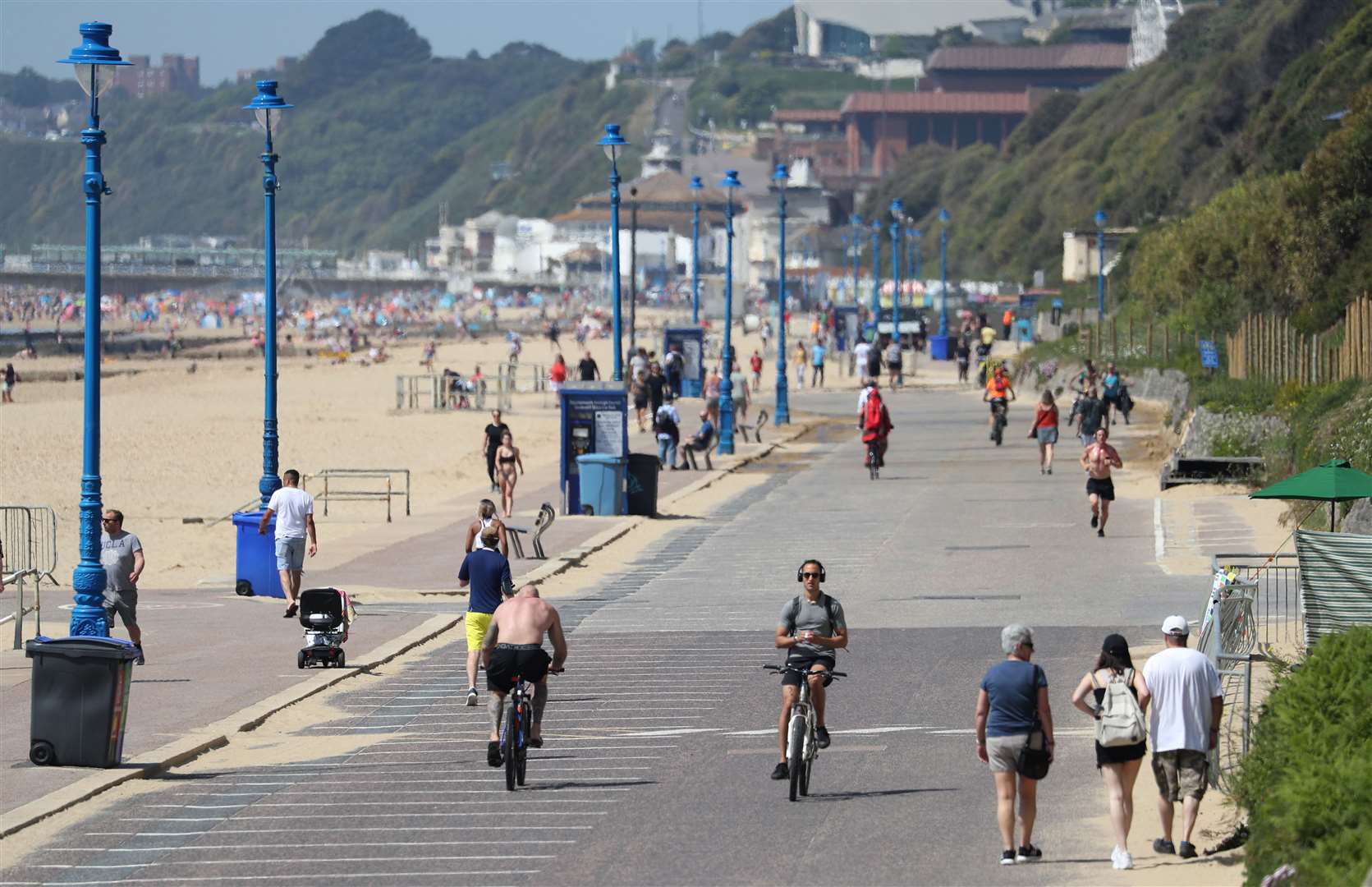 People make their way along the sea front in Bournemouth (Andrew Matthews/PA)