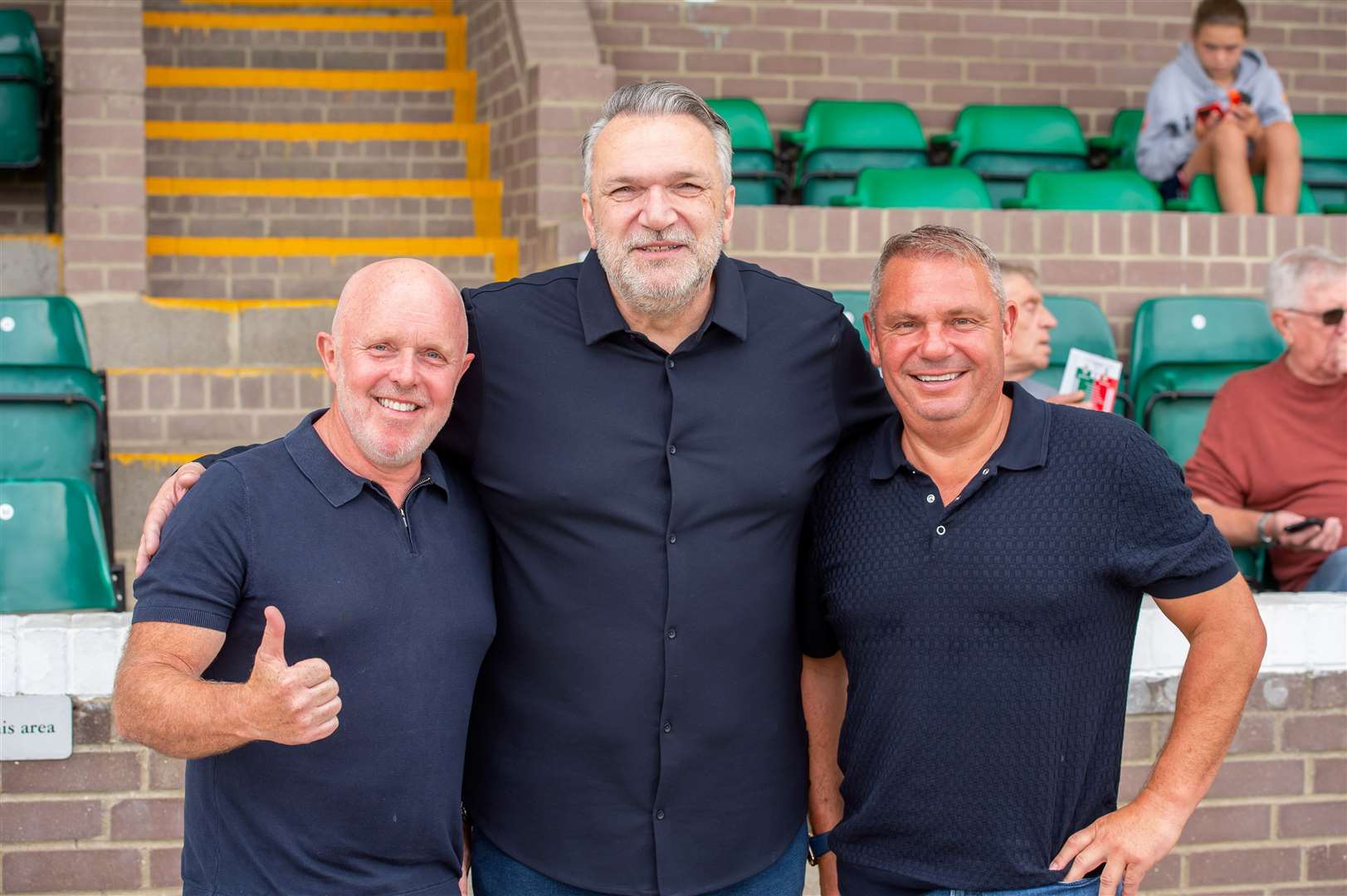 New Ashford United ambassador Neil Ruddock, centre, with incoming owners Dave Warr and Lloyd Hume. Picture: Ian Scammell