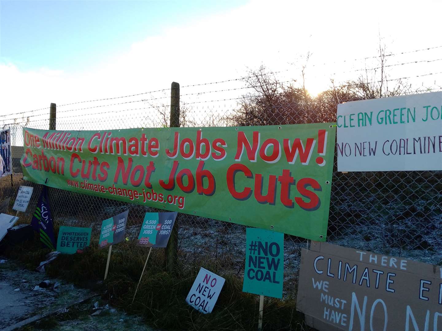 Protesters oppose the new coal mine near Whitehaven in Cumbria at the proposed site (PA)