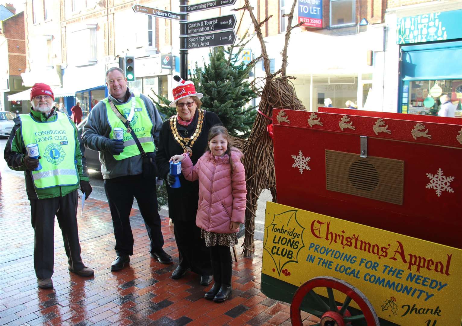 The barrel organ in action last Christmas, 2019, with the then Mayor, Cllr Jill Anderson, and Lions president Lofty Bunyon