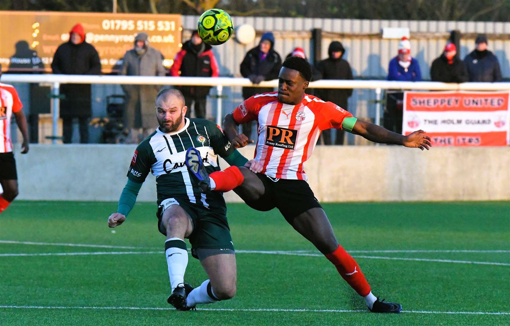 Ashford's top scorer Gary Lockyer is challenged by Sheppey defender Lekan Lekan Majoyegbe. Picture: Marc Richards