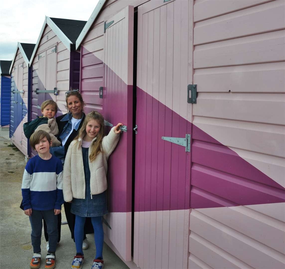 Hannah Carnell and her children opening up their new beach hut in Folkestone. Photo: FHDC