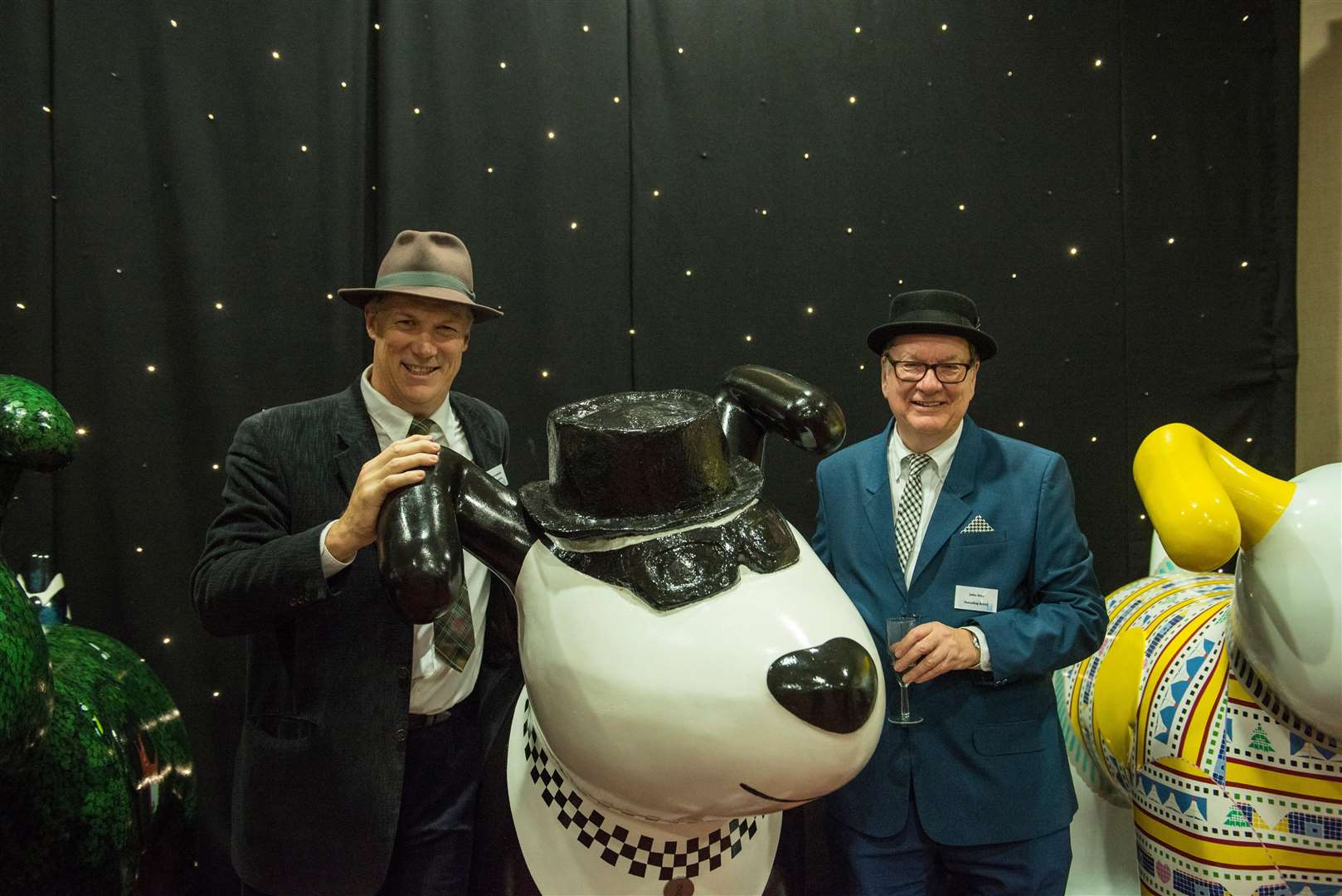 John Sims alongside his creation, the 2 Tone Ska Dog, which sold for £5,200