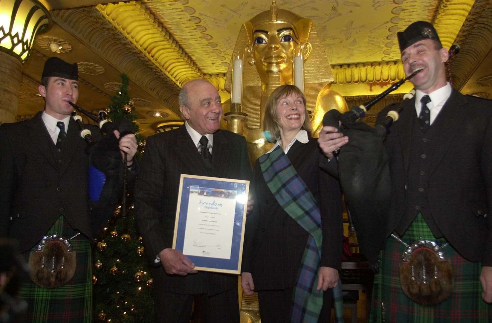 Mohamed Al Fayed accompanied by pipers after accepting a Freedom of the Highlands certificate (Ian Nicholson/PA)