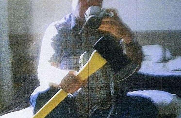 Dale Bolinger photographed himself with the axe he bought