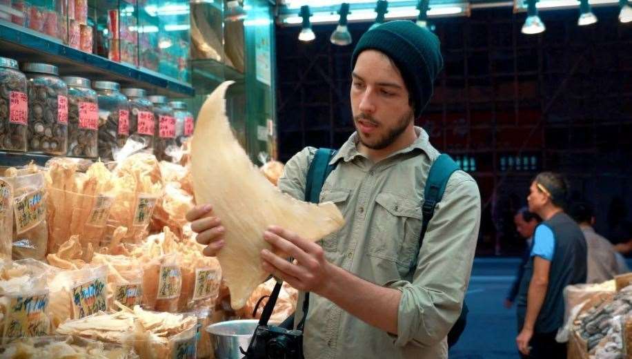 Ali Tabrizi in a shark fin market in Asia in a disturbing scene from his documentary. Picture: Seaspiracy / Netflix