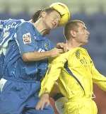 OUTNUMBERED: Tommy Johnson is beaten in the air by two defenders. Picture: GRANT FALVEY