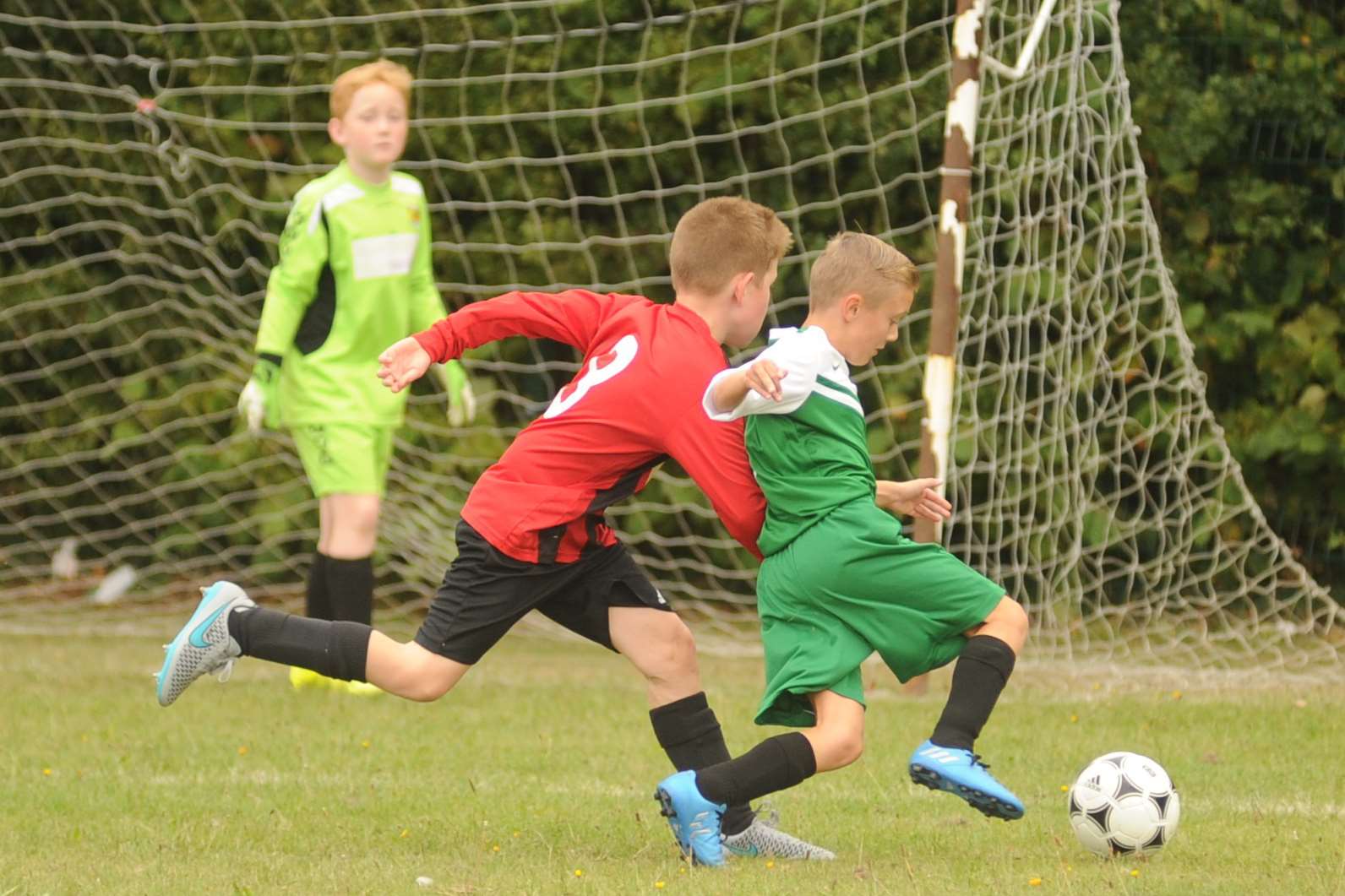 New Ash Green under-11s battle Woodcoombe Youth Picture: Steve Crispe