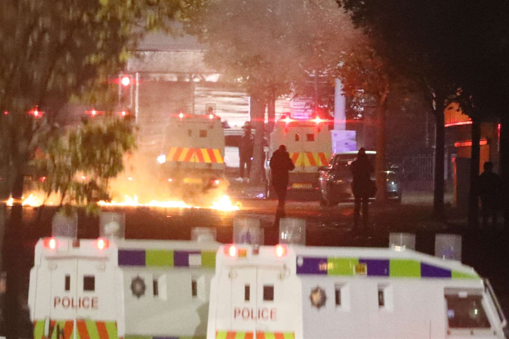 Missiles and fireworks being thrown at police on Lanark Way in the loyalist Shankill Road area close to the peace wall (Brian Lawless/PA)