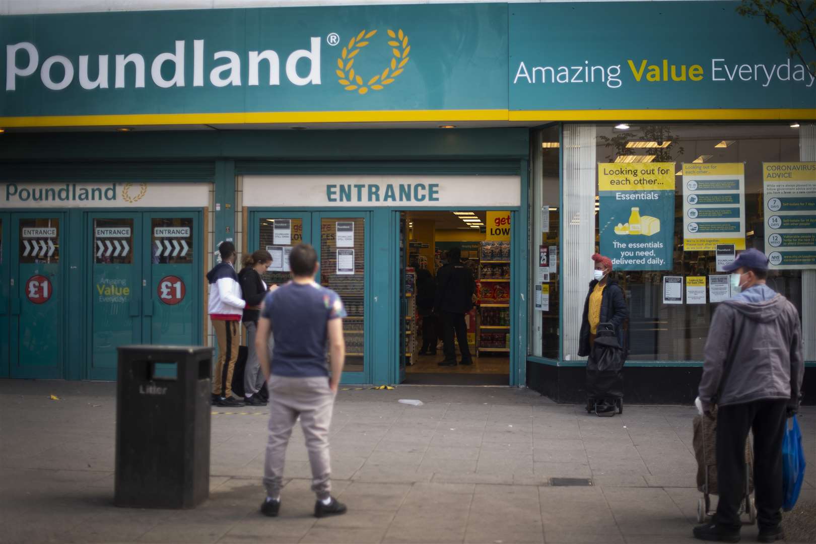 Essential shops have remained open but with social distancing measures in place (Victoria Jones/PA)