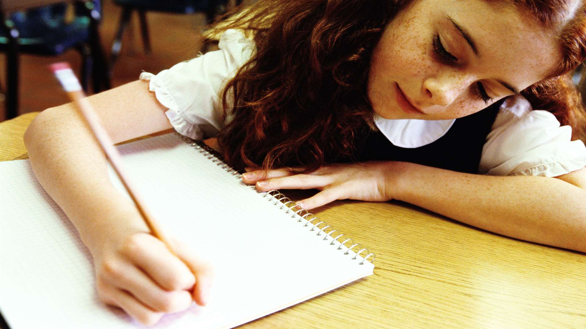 Girl sitting exam. Stock image.